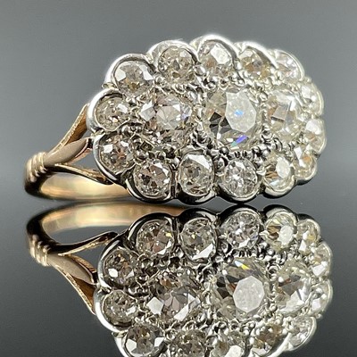 Lot 664 - An 18ct diamond cluster 17 stone ring, the...