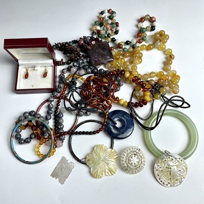 Lot 920 - Costume jewellery including a jadeite bangle...