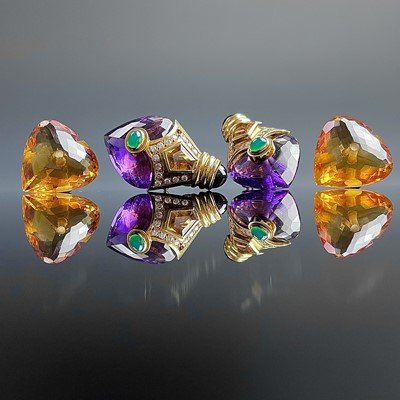 Lot 1045 - An 18ct stylish pair of 1980's gem set clip...