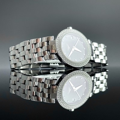 Lot 961 - A Longines ladies stainless steel diamond set...