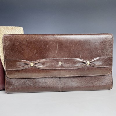 Lot 1033 - An Etienne Aigner brown leather clutch bag,...