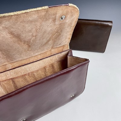 Lot 1033 - An Etienne Aigner brown leather clutch bag,...