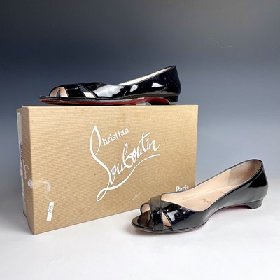 Lot 1004 - Christian Louboutin, a pair of black patent...