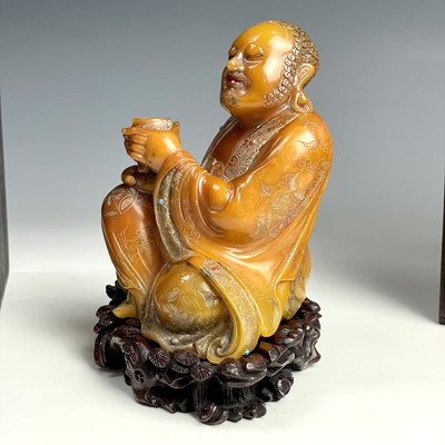 Lot 35 - A Chinese Shoushan hardstone carving of Louhan,...