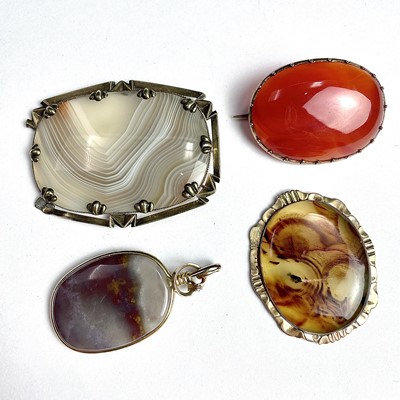 Lot 792 - Three gold mounted agate brooches together...
