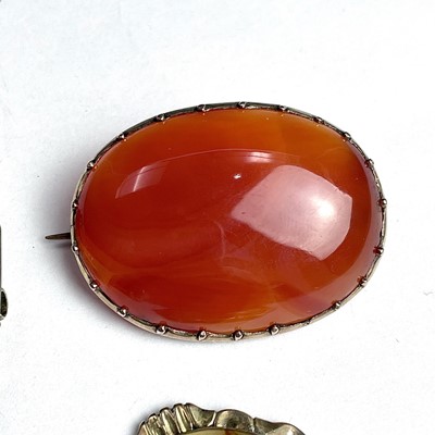 Lot 792 - Three gold mounted agate brooches together...
