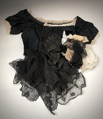 Lot 2818 - A late Victorian black silk boned bodice...