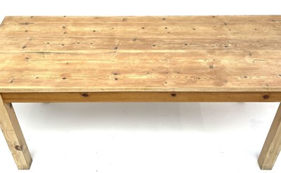 Lot 62 - A pine rectangular kitchen table, mid 20th century.