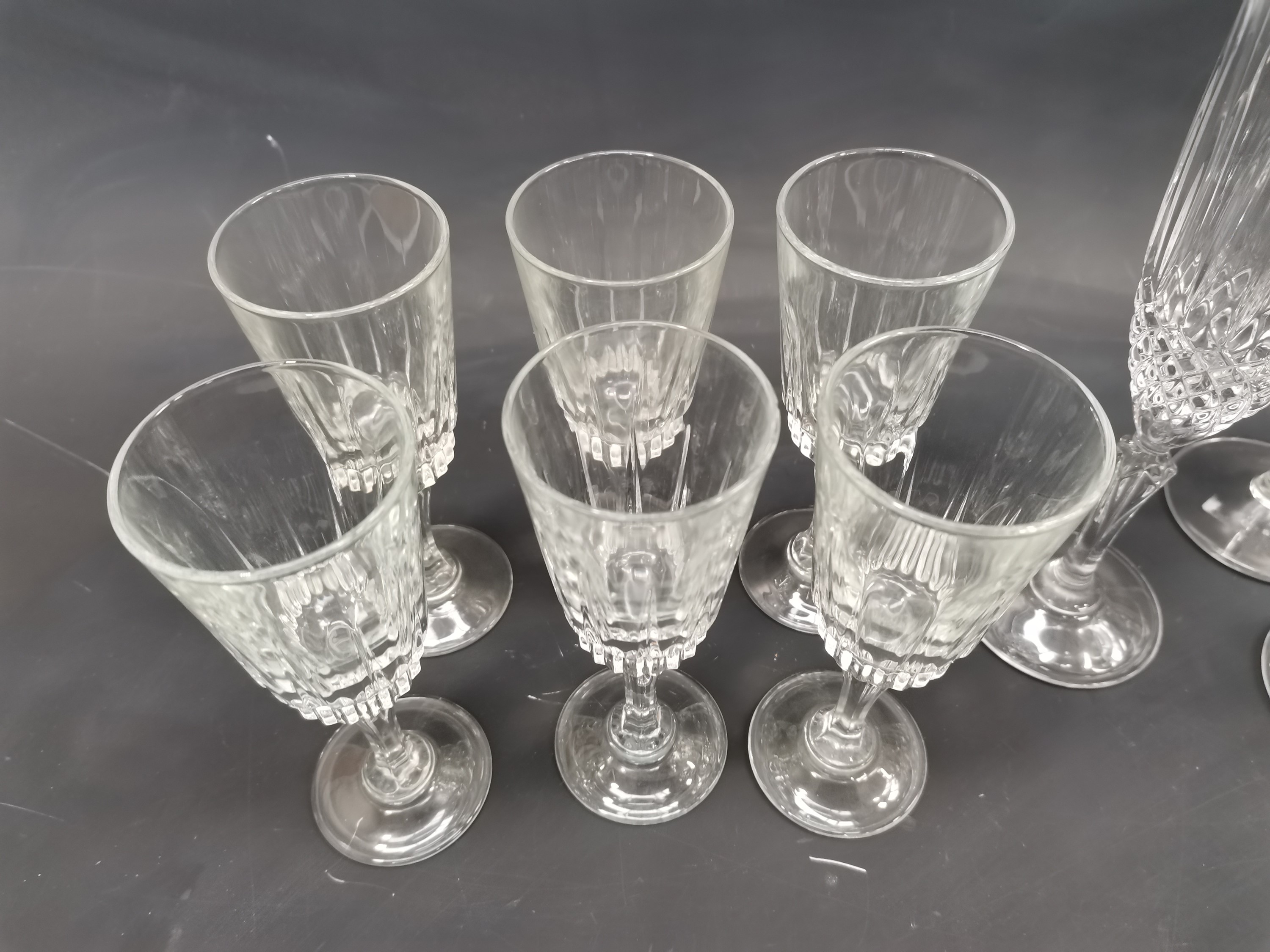 Lot 125 - Seven flute glasses, one of which is pressed