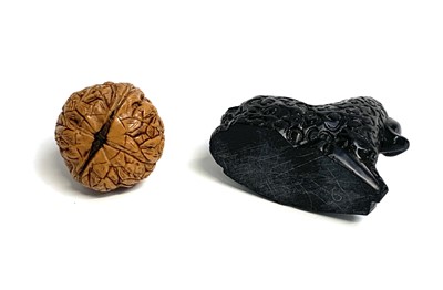 Lot 420 - A Chinese carved walnut shell, depicting...