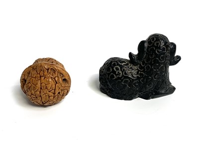 Lot 420 - A Chinese carved walnut shell, depicting...