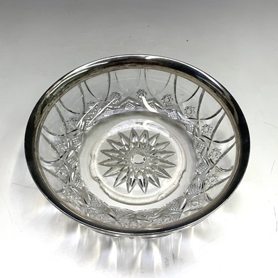 Lot 1057 - A cut glass fruit bowl with silver mounted rim,...