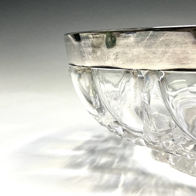 Lot 1057 - A cut glass fruit bowl with silver mounted rim,...