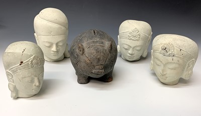 Lot 427 - Four Balinese sandstone heads, 20th century,...