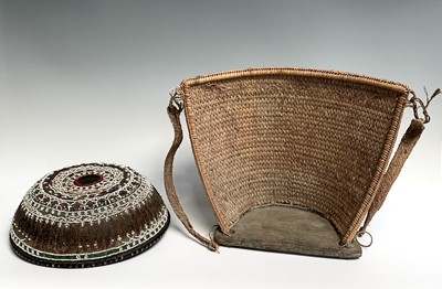 Lot 430 - A Dayak baby carrier, Borneo, the woven cane...