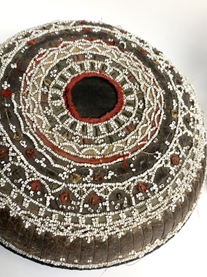 Lot 430 - A Dayak baby carrier, Borneo, the woven cane...