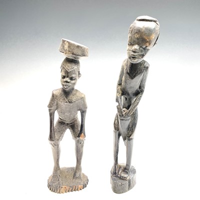 Lot 372 - An African wood carved figure together with...