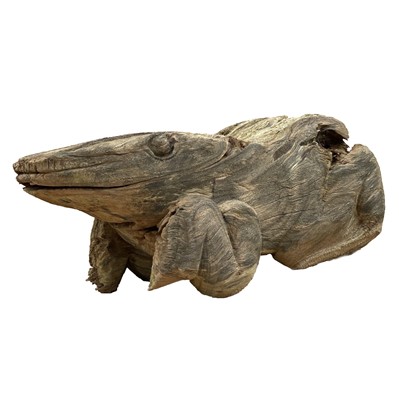 Lot 606 - An elm large carving of a toad, length 76cm.