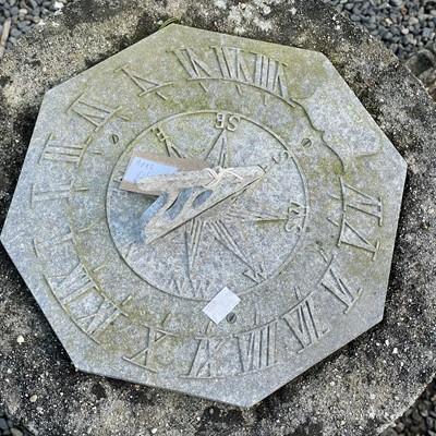 Lot 614 - A cast metal sundial on a square reconstituted...