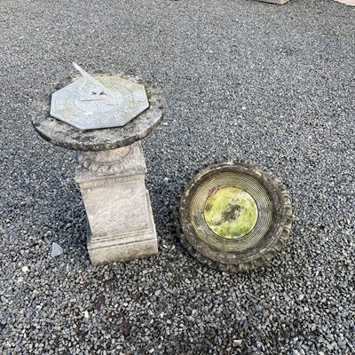 Lot 614 - A cast metal sundial on a square reconstituted...