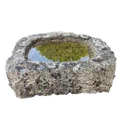 Lot 618 - A shallow granite trough of a rough hewn...