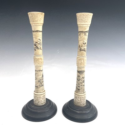 Lot 439 - A pair of Japanese carved bone candlesticks,...