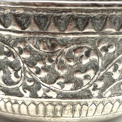 Lot 1052 - A set of four Indian white metal bowls, each...