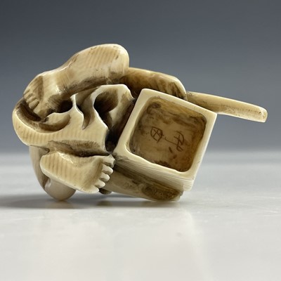Lot 558 - A Japanese ivory netsuke of a rat catcher,...