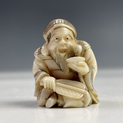 Lot 563 - A Japanese ivory netsuke, Meiji period, signed,...