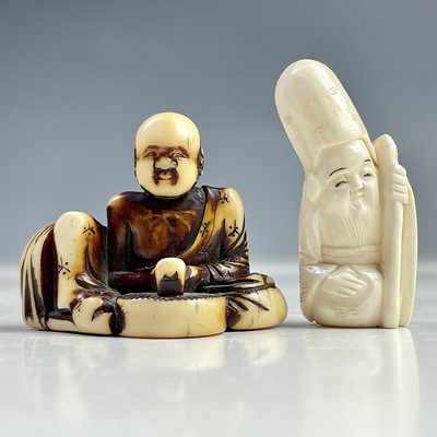 Lot 564 - A Japanese stained ivory netsuke, Meiji period,...