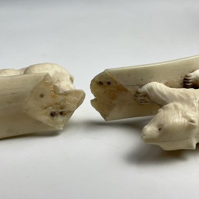 Lot 568 - An inuit carving on walrus tusk carved with...