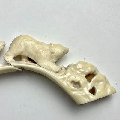 Lot 568 - An inuit carving on walrus tusk carved with...