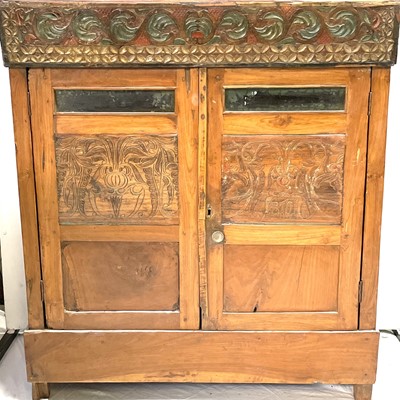 Lot 505 - A Balinese carved wood side cabinet, mid 20th...