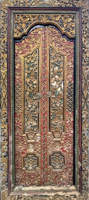 Lot 506 - A pair of Chinese carved giltwood doors and...