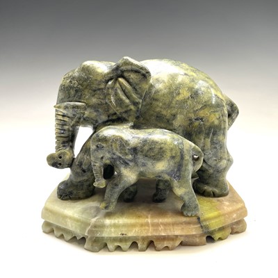 Lot 1060 - An Indian green hardstone model of elephants,...