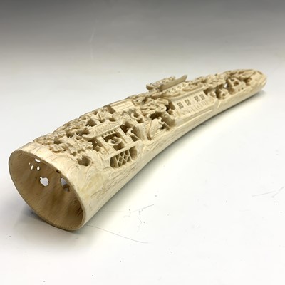 Lot 581 - A Chinese carved ivory tusk, circa 1920, with...