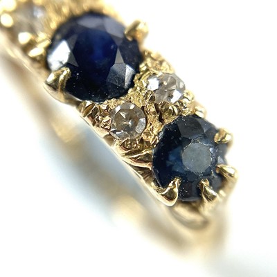 Lot 16 - An early 20th century 18ct diamond and sapphire seven stone ring