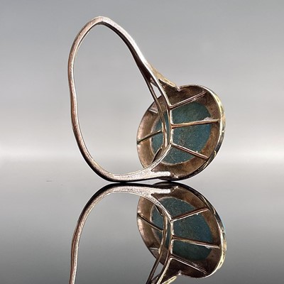 Lot 129 - A 9ct gold turquoise set ring, the oval...