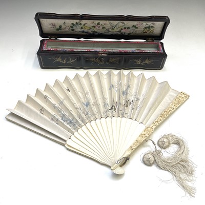 Lot 590 - A Chinese Canton carved ivory and silk fan,...