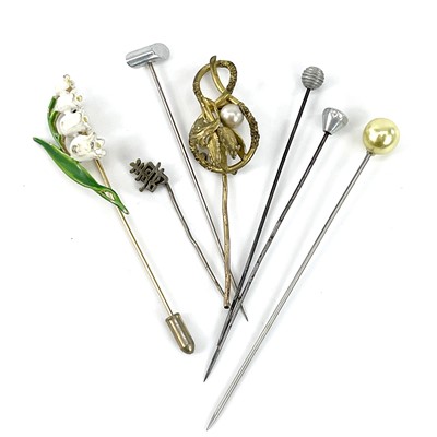 Lot 260 - A collection of hatpins including a silver and...