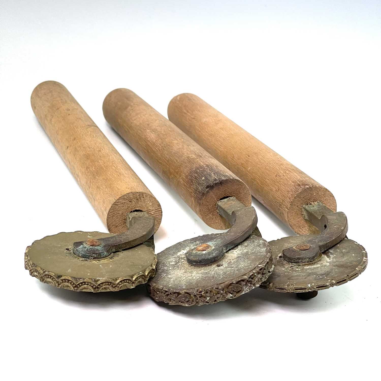Lot 57 - Three leatherworkers tools, each with embossed...
