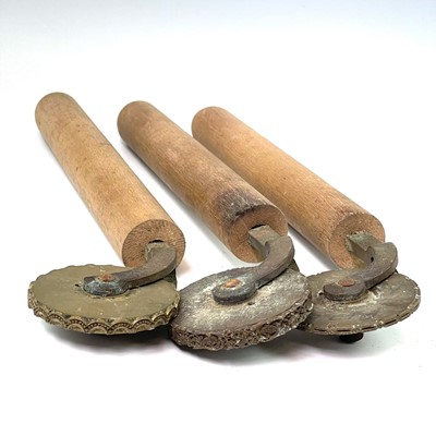 Lot 57 - Three leatherworkers tools, each with embossed...