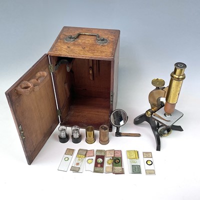 Lot 54 - A brass and lacquered microscope, circa 1900,...