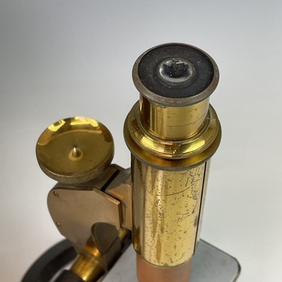 Lot 54 - A brass and lacquered microscope, circa 1900,...