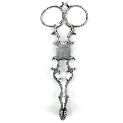 Lot 141 - A pair of George III silver scissor action...
