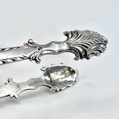 Lot 166 - A pair of George III silver sugar nips with...