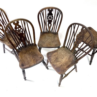 Lot 79 - A harlequin set of five 19th century elm and...