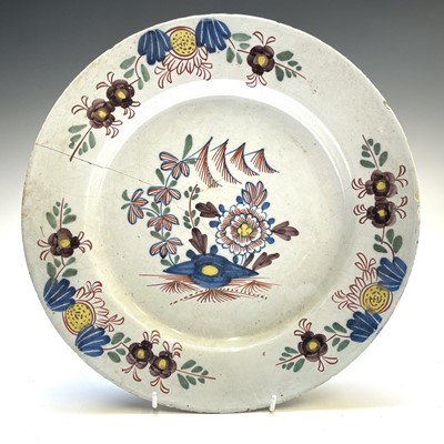 Lot 26 - An English Delft polychrome plate, mid 18th...