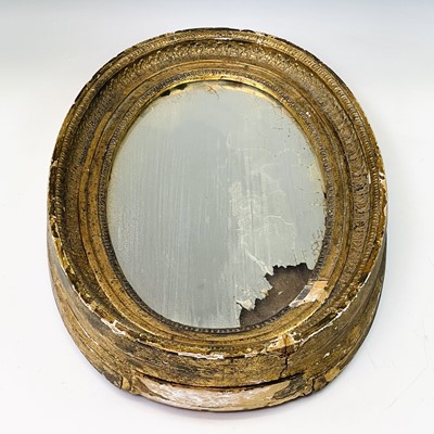 Lot 3118 - A late Victorian oval Gilt mirror, the...