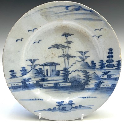 Lot 42 - An 18th century English Delft plate, decorated...